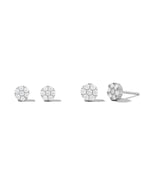 Sterling silver big and small stud earrings on white background.
