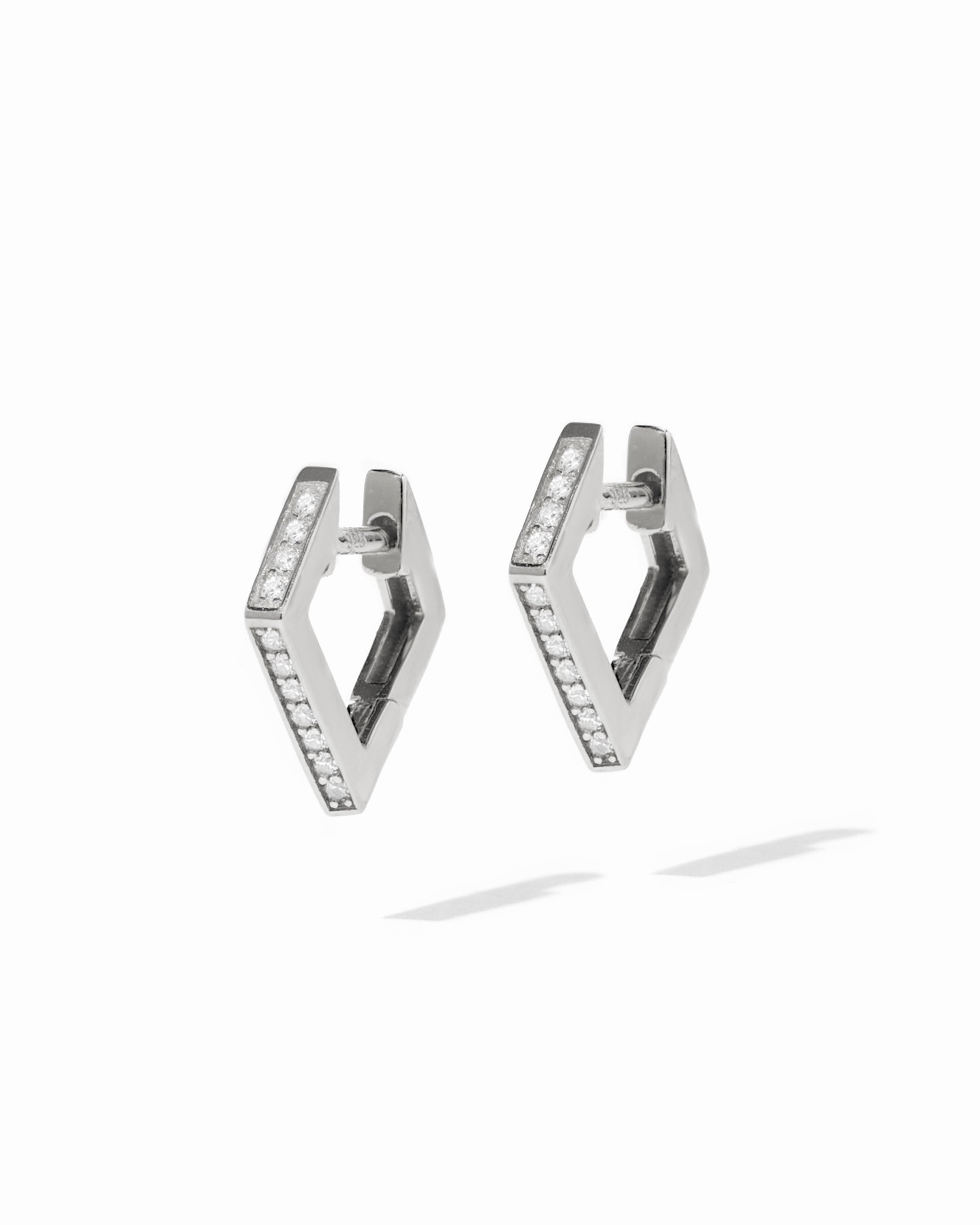 Sterling silver geometric studded hoop earrings.