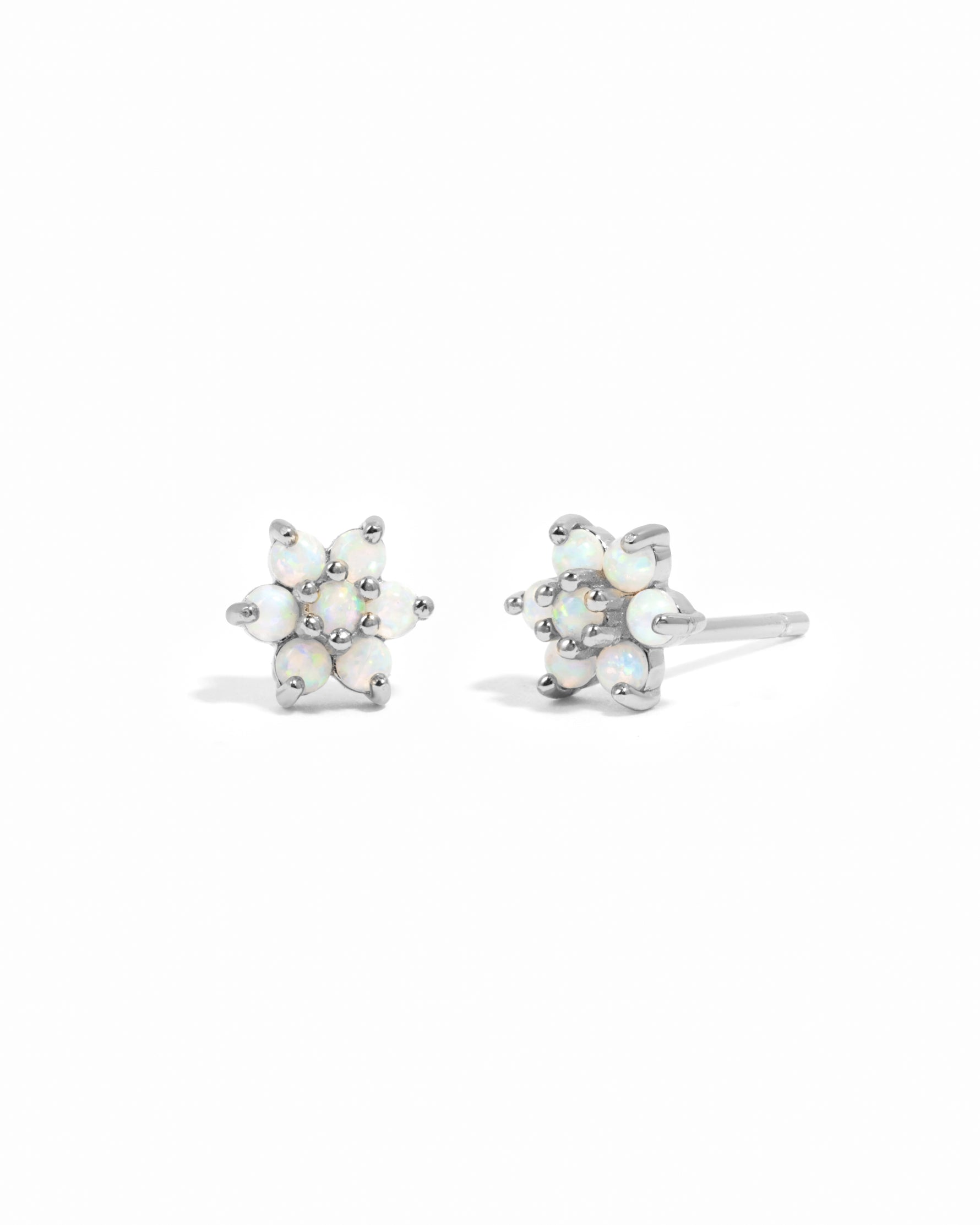 Delicate sterling silver opal gemstone flower stud earrings.
