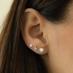 Model wearing sterling silver opal minimalist stud earrings. 