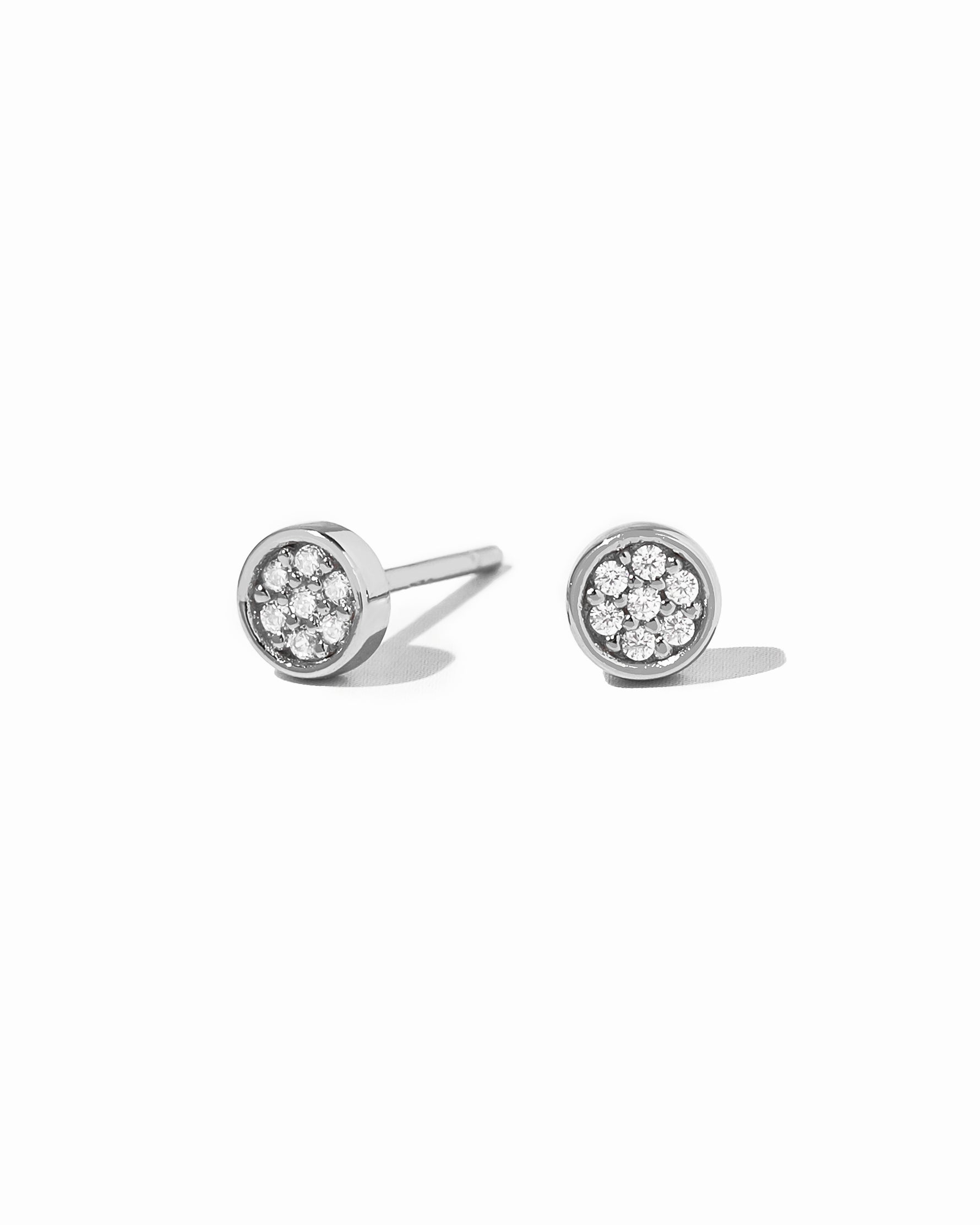 Silver pave stud earrings with disc design
