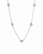 Silver plain star collar charm necklace on white background.