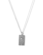 Rectangle silver rose medallion pendant necklace on white background.