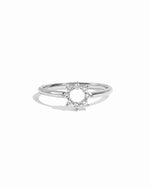 Sterling silver cz sunburst ring on white background. 