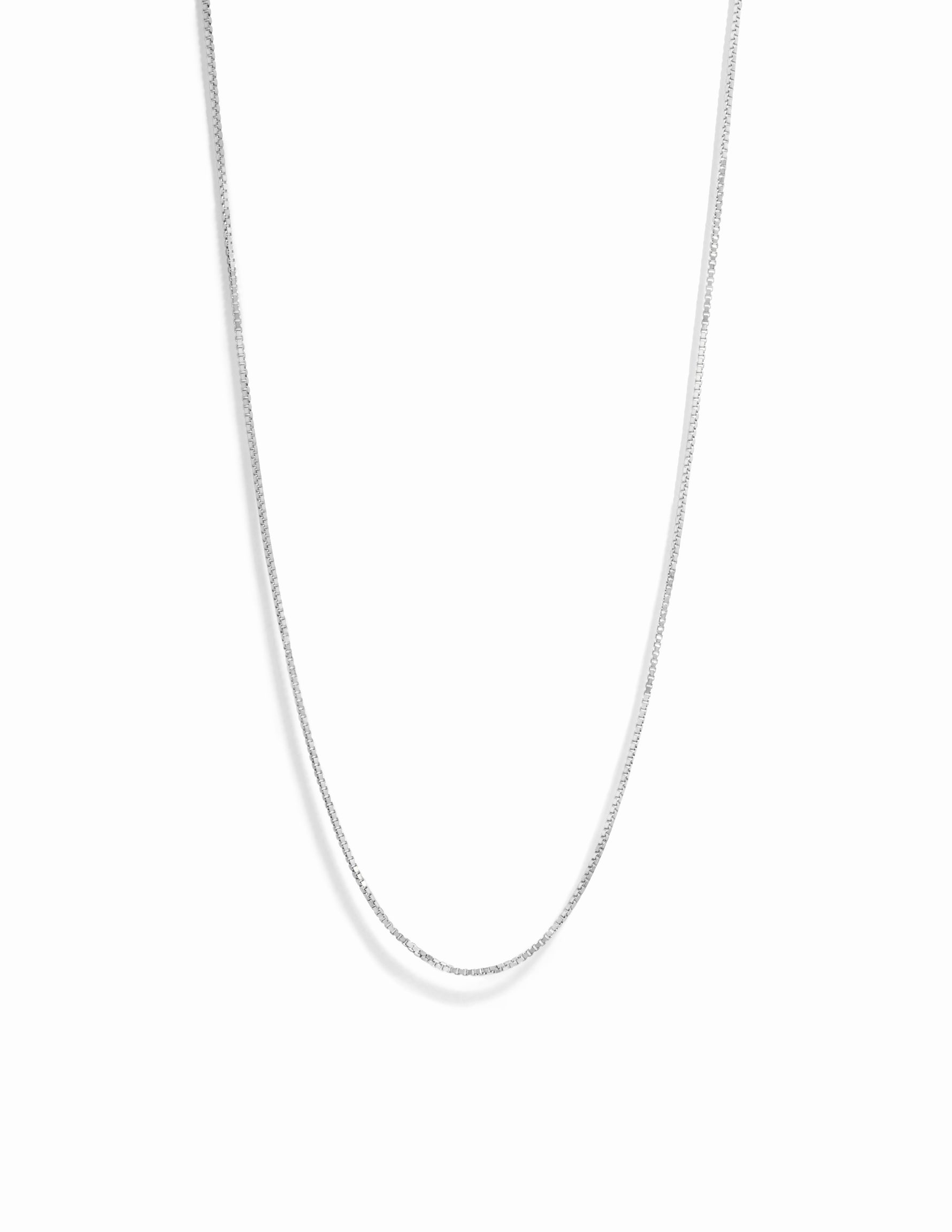 Silver box chain necklace on white background