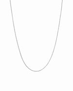 Sterling silver dainty thin chain necklace on white background.