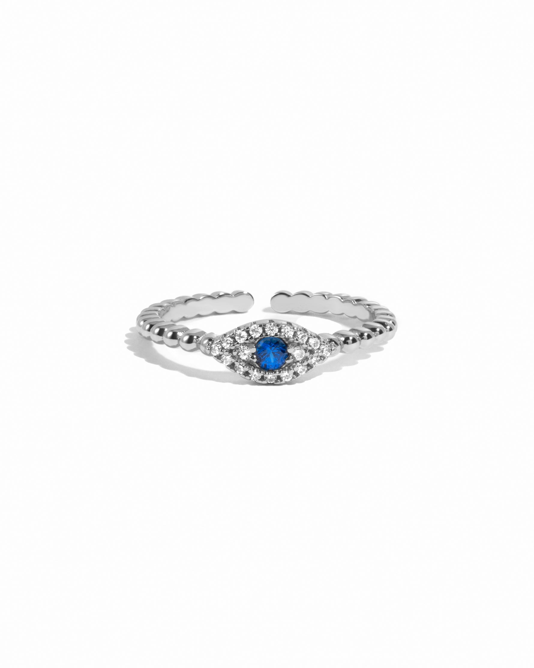 Sterling silver adjustable beaded evil eye ring on white background. 