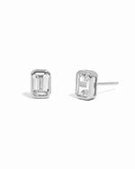 Sterling silver emerald-cut bezel diamond cz stud earrings on white background.