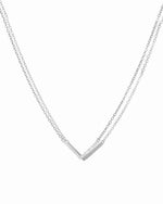 Sterling silver chevron necklace on white background.