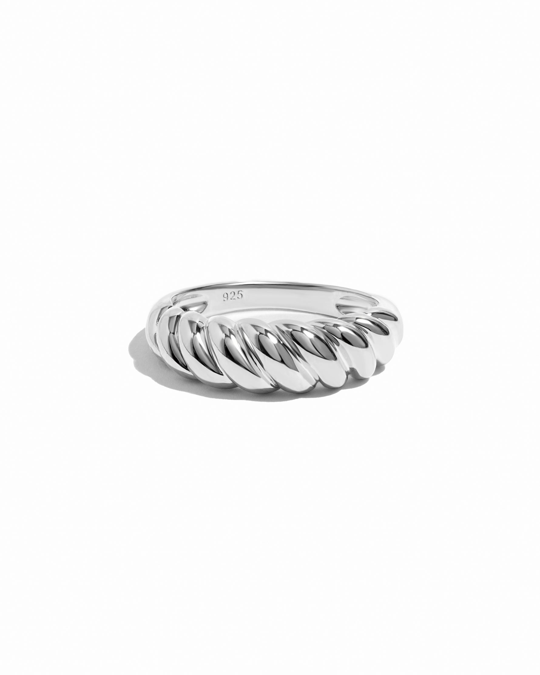 Sterling silver croissant ring on white background.