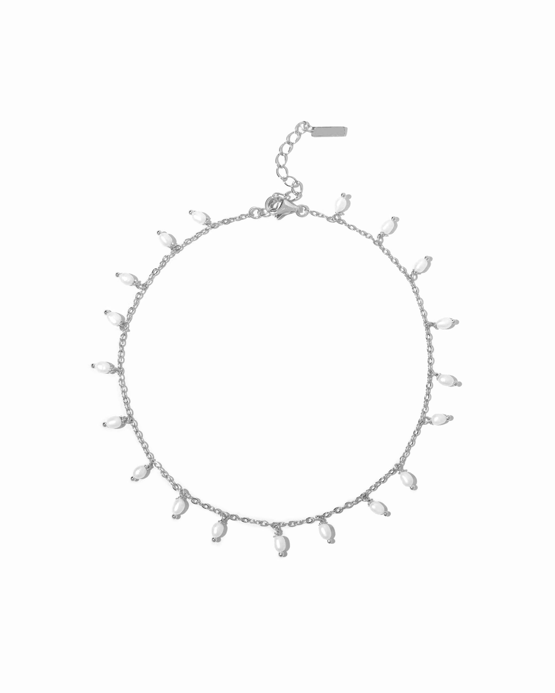 Sterling silver pearl charm ankle bracelet on white background