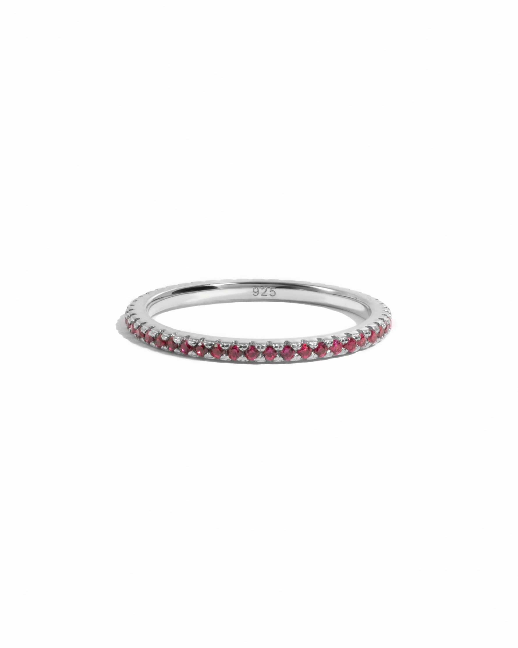 Sterling silver ruby eternity ring on white background.