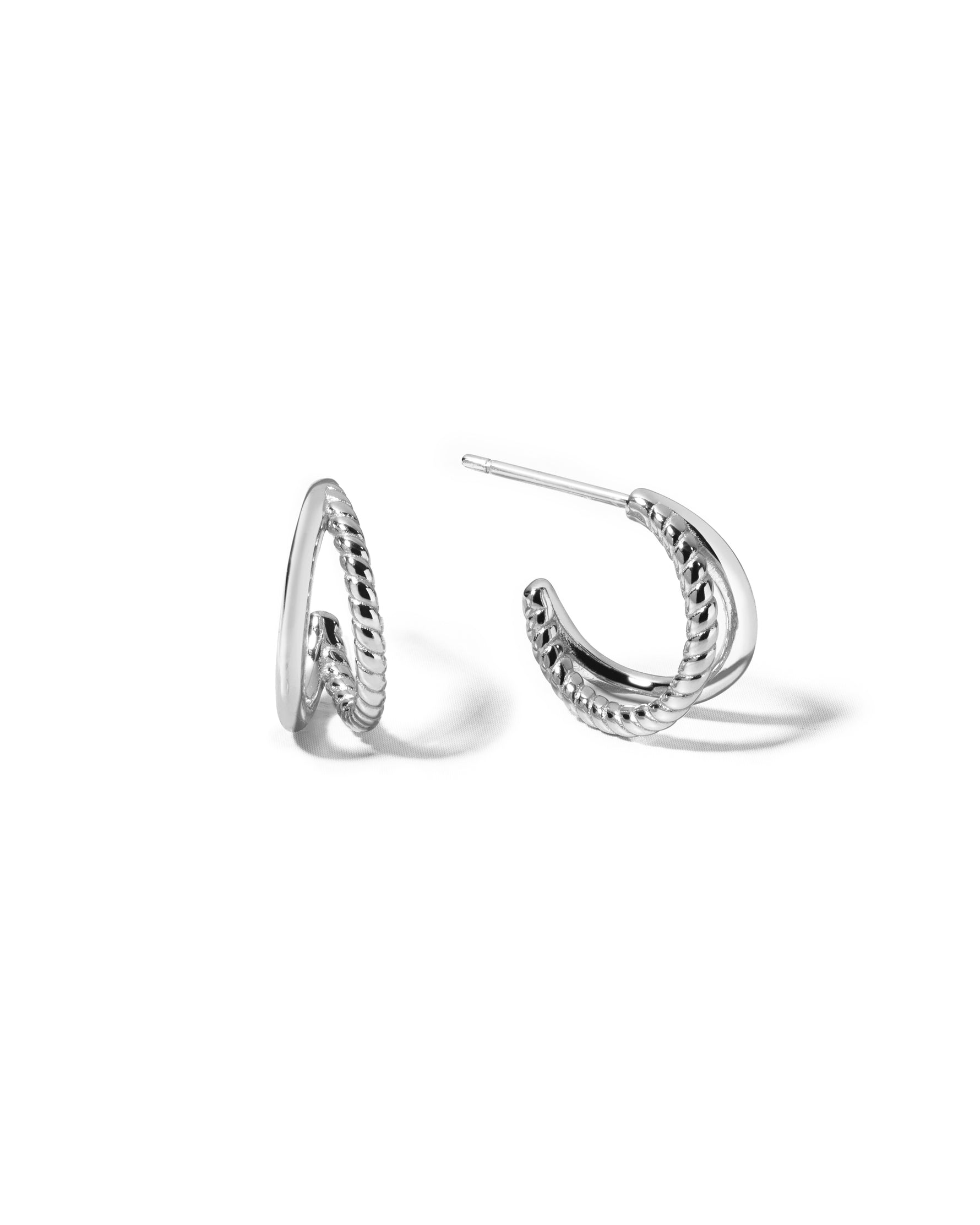 Dainty sterling silver split shank hoop earrings with a spiral and plain side. 