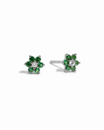 Dainty sterling silver emerald birthstone flower stud earrings with white diamond in the center on white background.