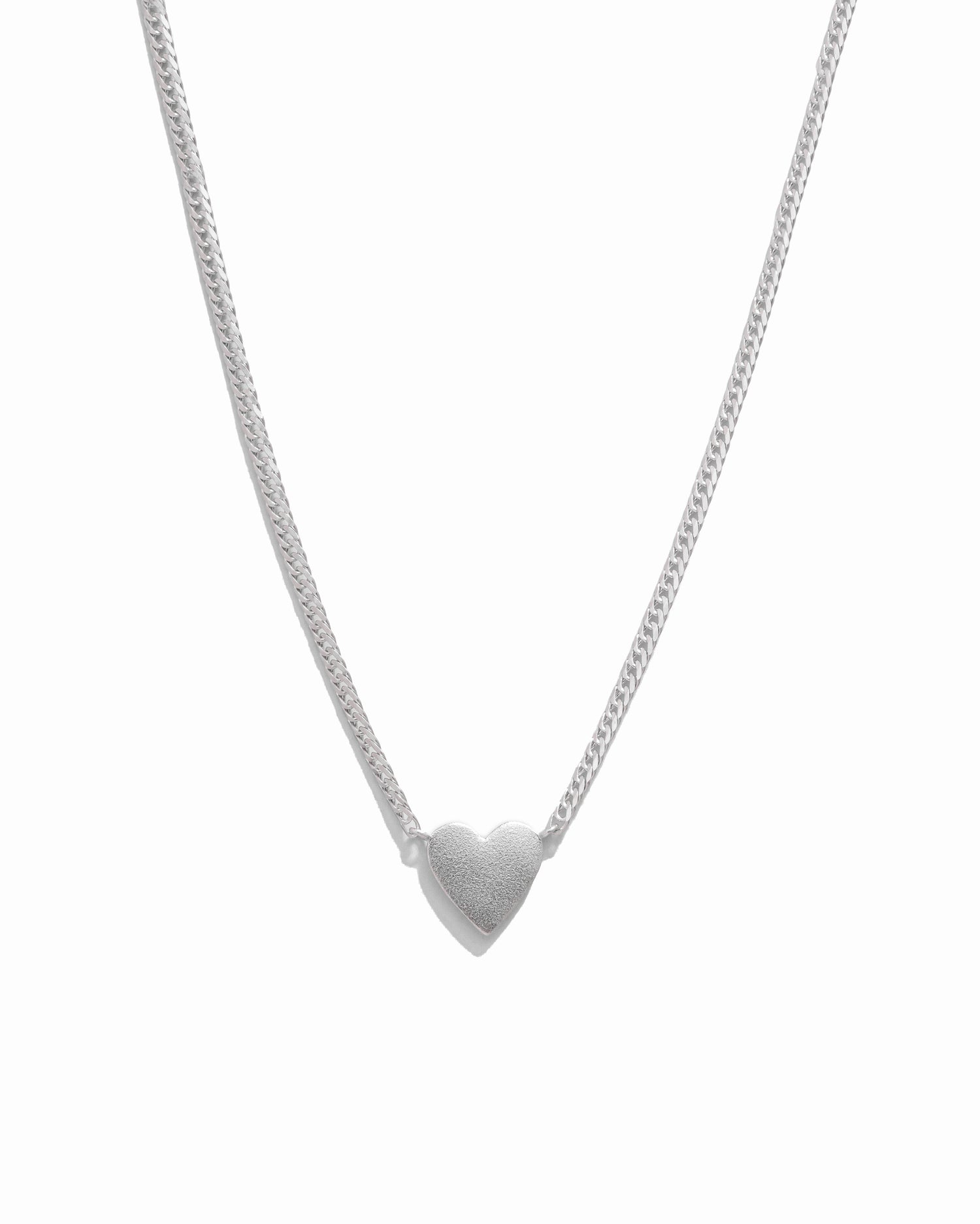 Sterling silver heart pendant necklace with cuban line chain.