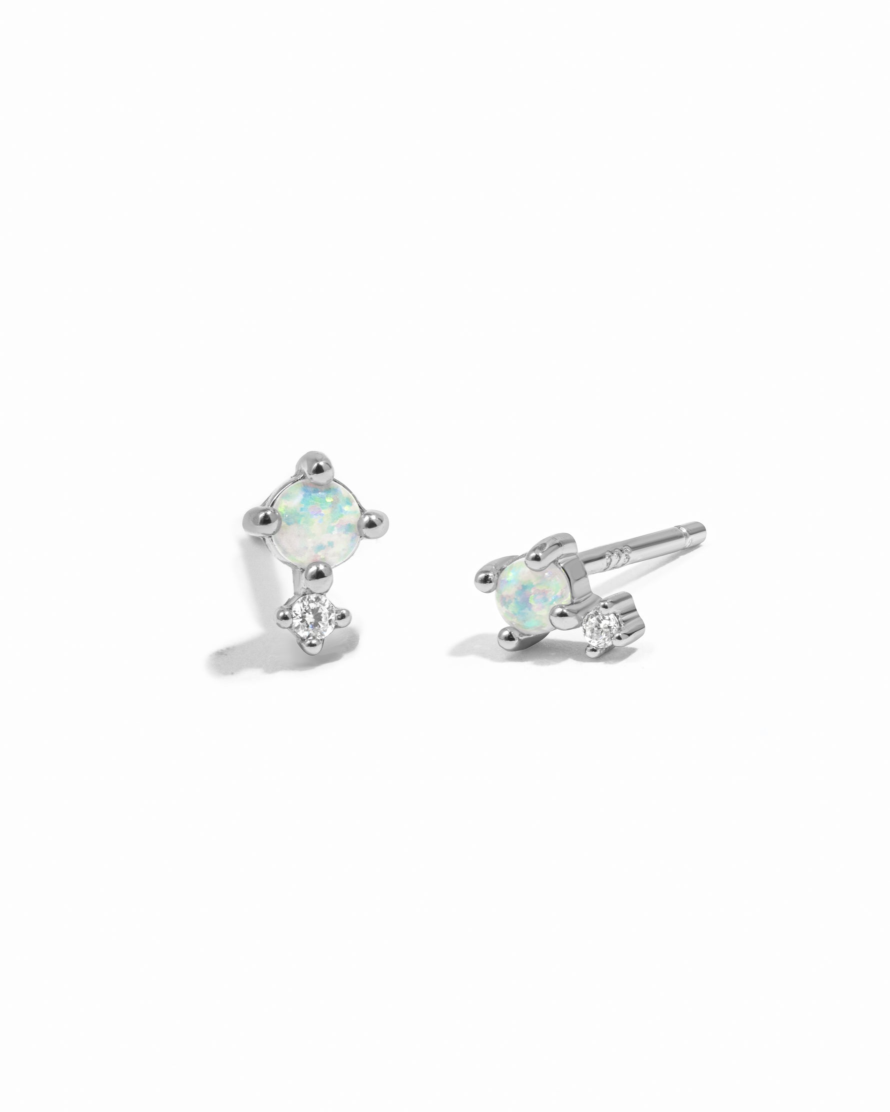 Sterling silver dainty opal and cz stone stud earrings. 