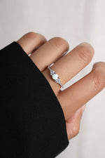 Model wearing silver opal stone ring. 