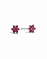 Dainty silver ruby flower stud earrings.