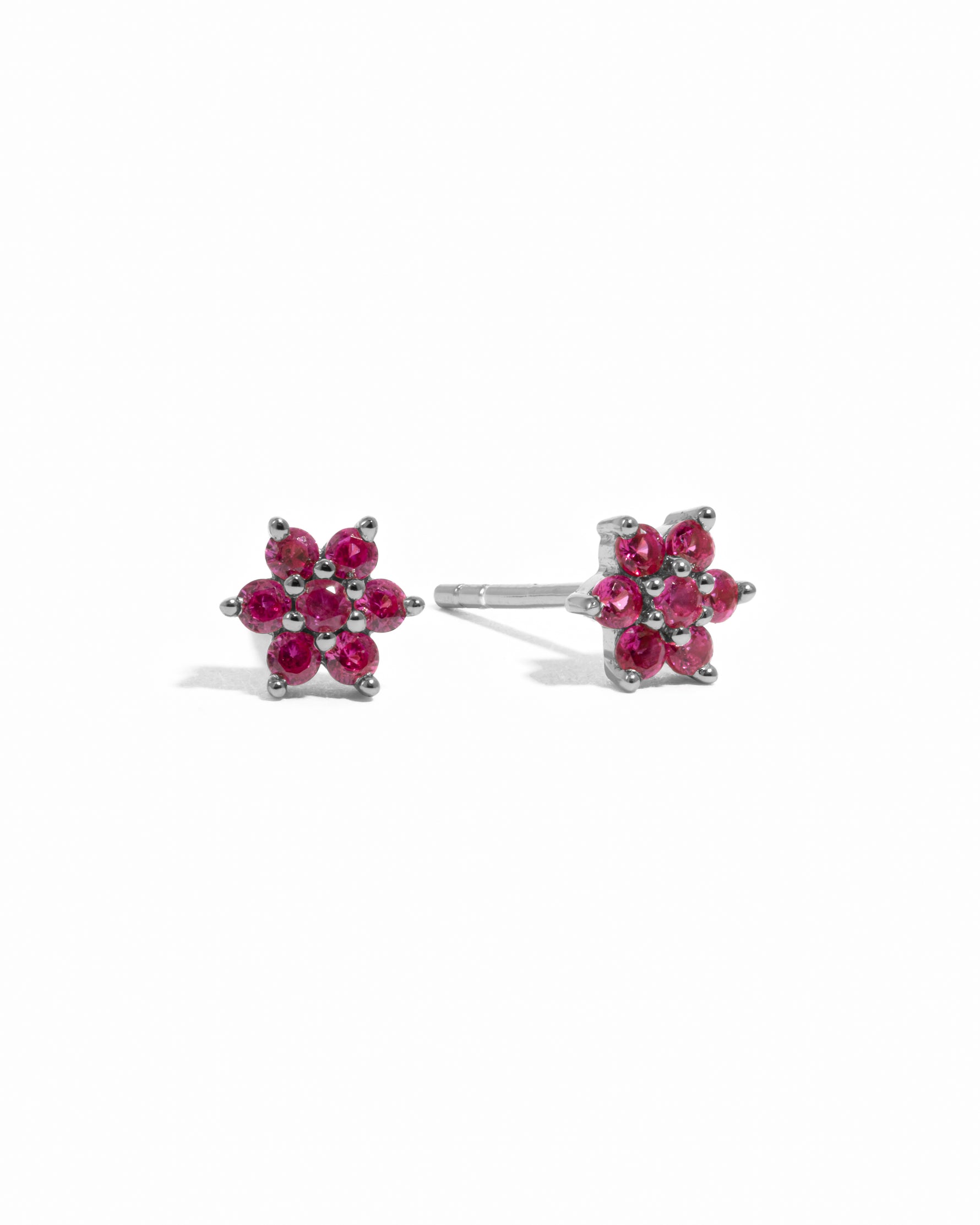 Dainty silver ruby flower stud earrings.