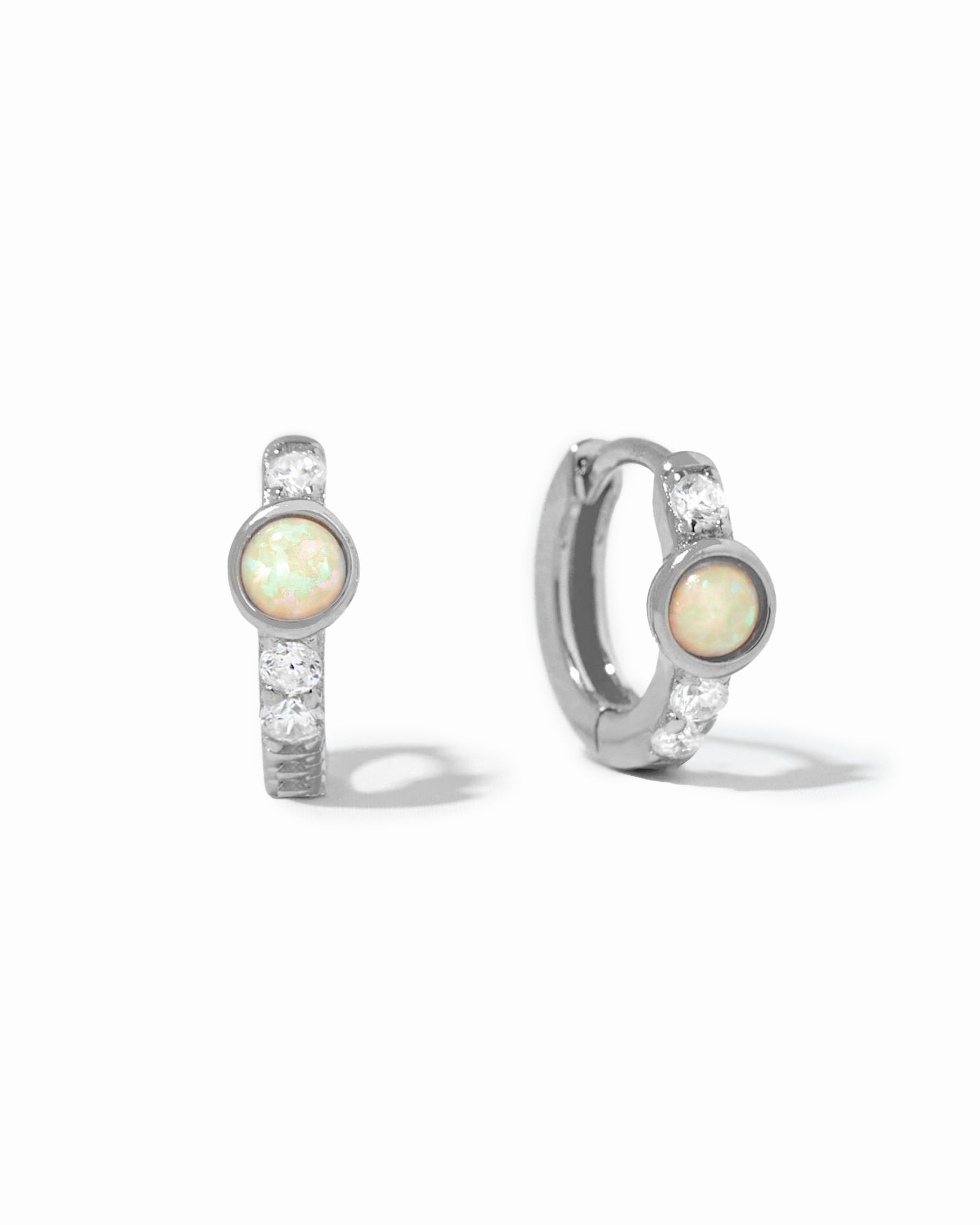Sterling silver dainty solitaire opal cz studded huggie earrings.
