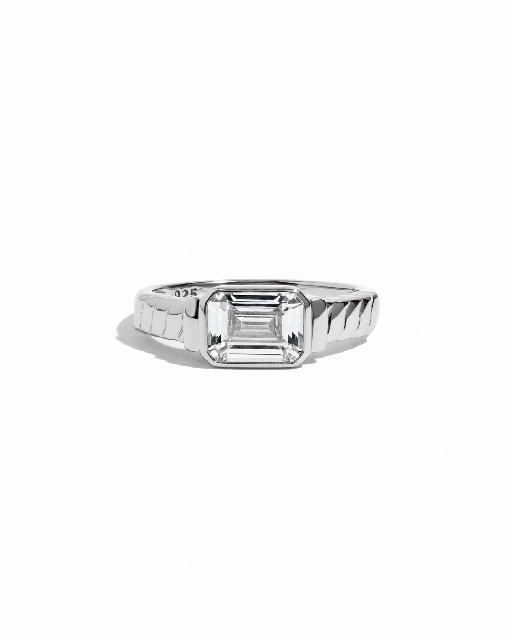 Sterling silver emerald-cut statement ring with texture silver band. 
