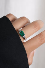 Model wearing sterling silver gemstone ring. 