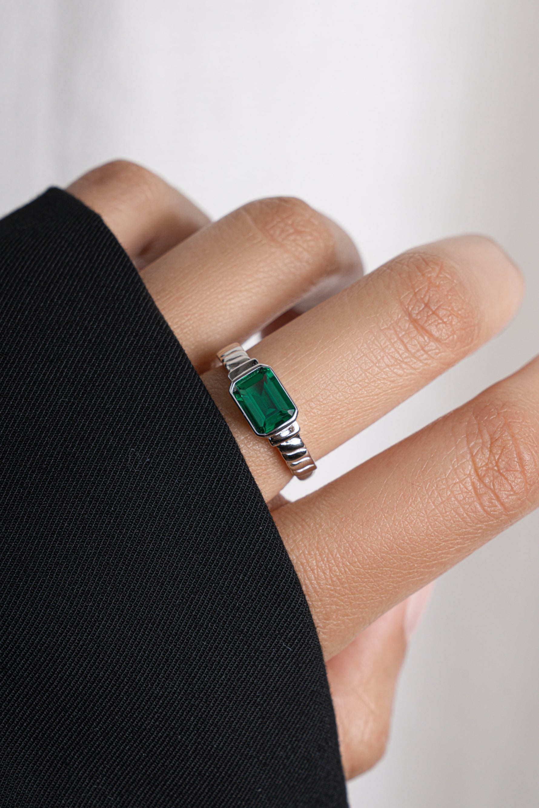 Model wearing sterling silver gemstone ring. 