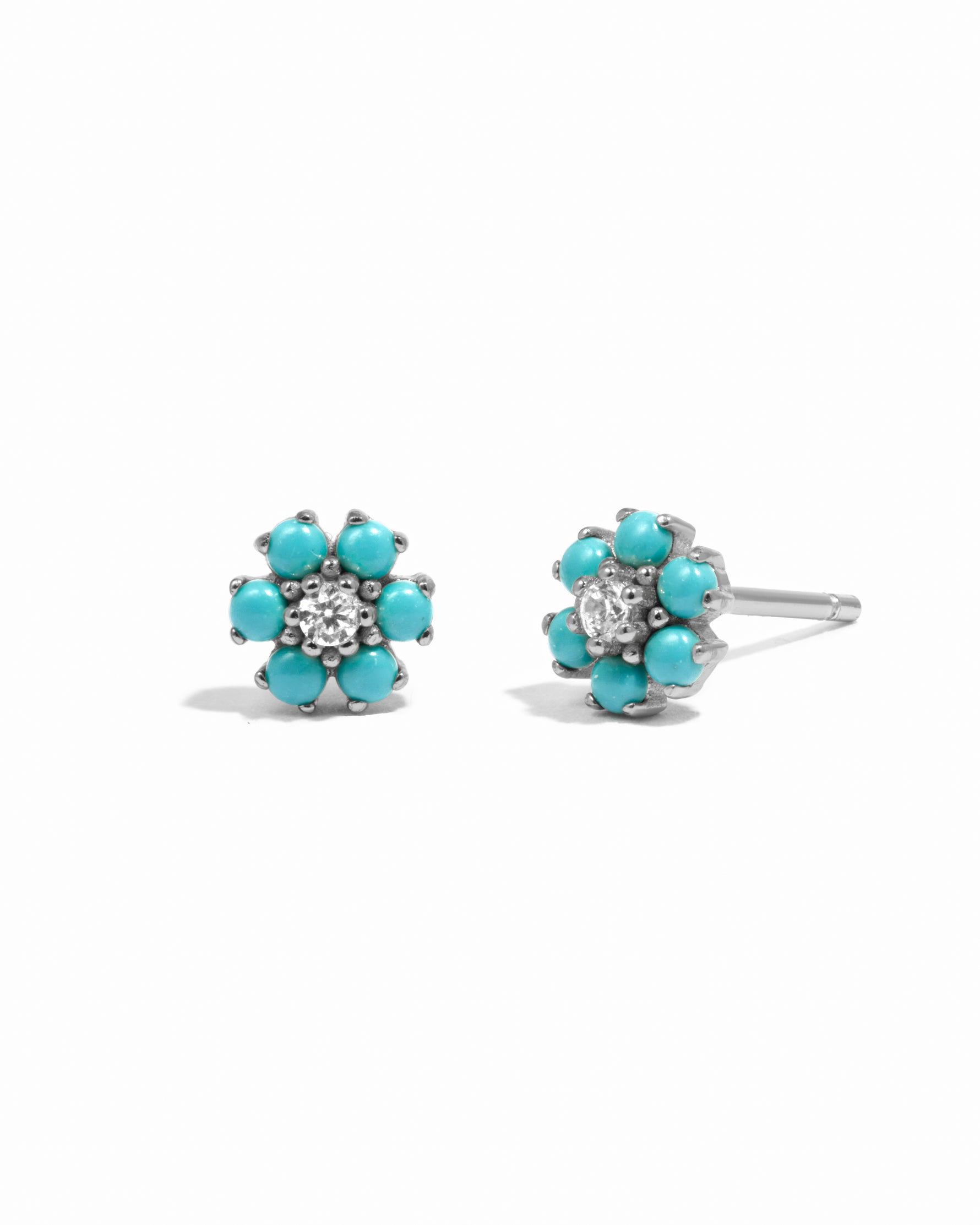 Silver turquoise flower stud earrings with cz stone center. 