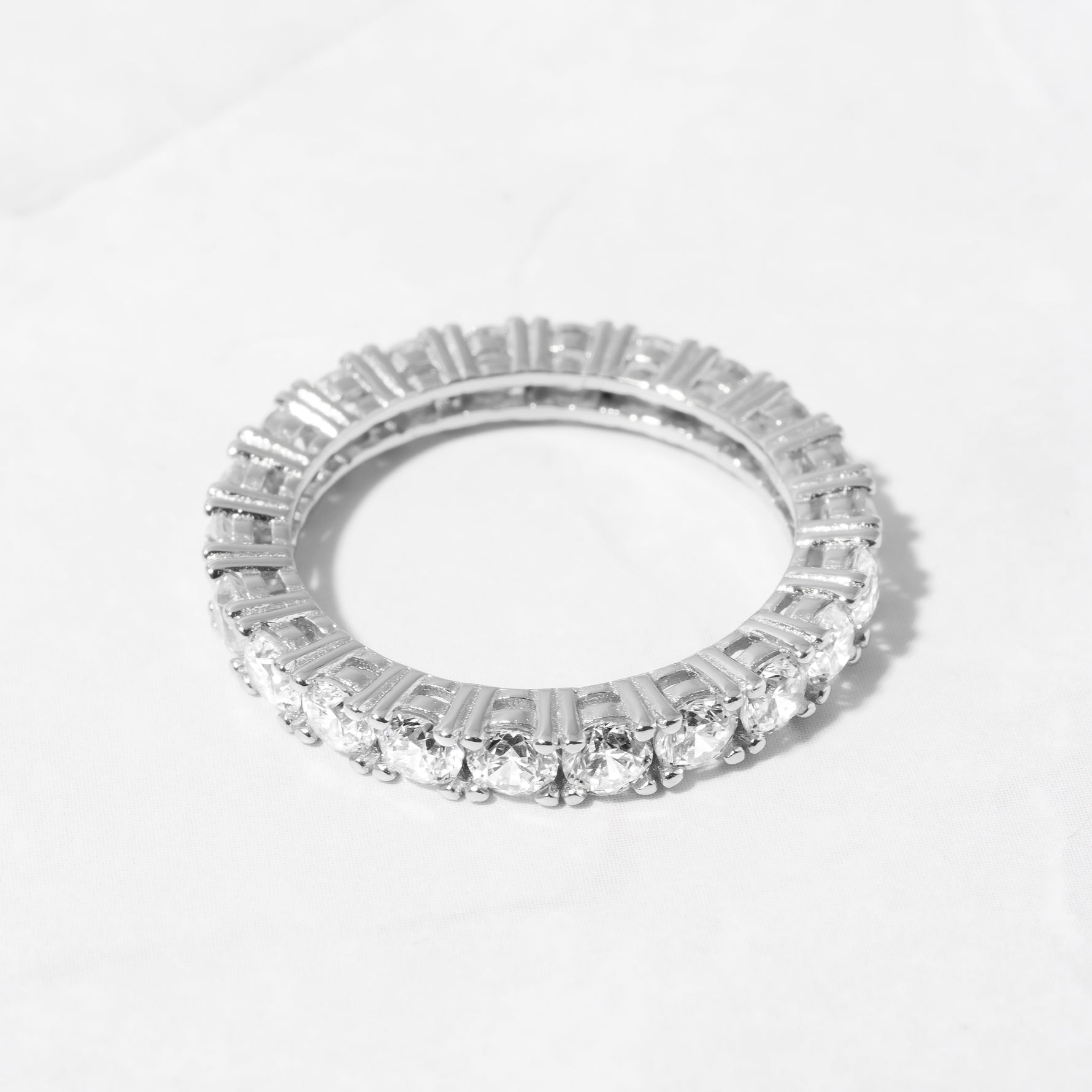 Upclose shot of sterling silver 3MM studded diamond stacking band. 