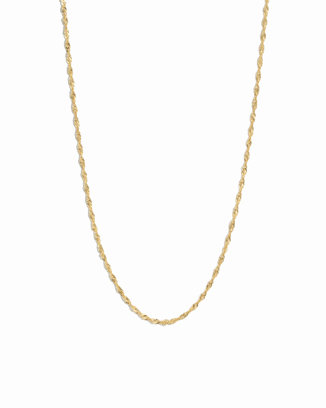 Thin gold twisted chain necklace on white background