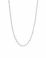Silver dainty thin twisted chain necklace on white background.