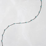 Up close image of silver turquoise simple beaded anklet
