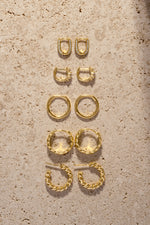 Trendy gold hoop earrings with unique and textured designs