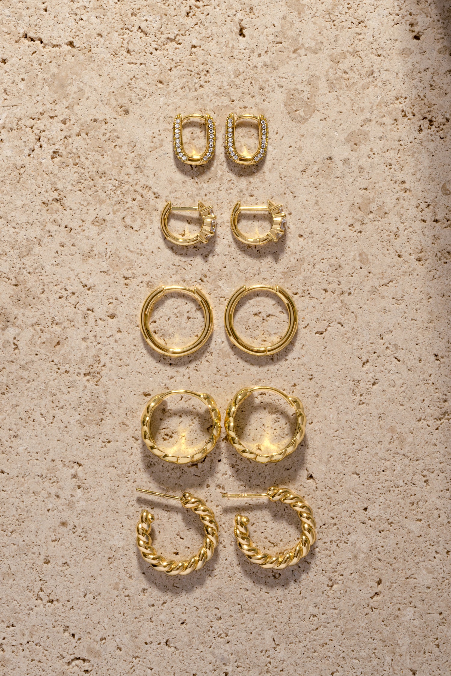 Trendy gold hoop earrings with unique and textured designs