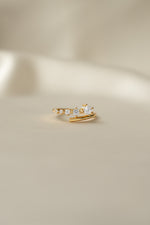 Sami Jewels Dainty Gradient Bypass Ring in 925 Sterling Silver plated in 14k gold on a beige background