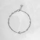 silver chain bracelet with a bezel charm