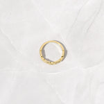 Bird's eye view of gold pave chain link ring. 