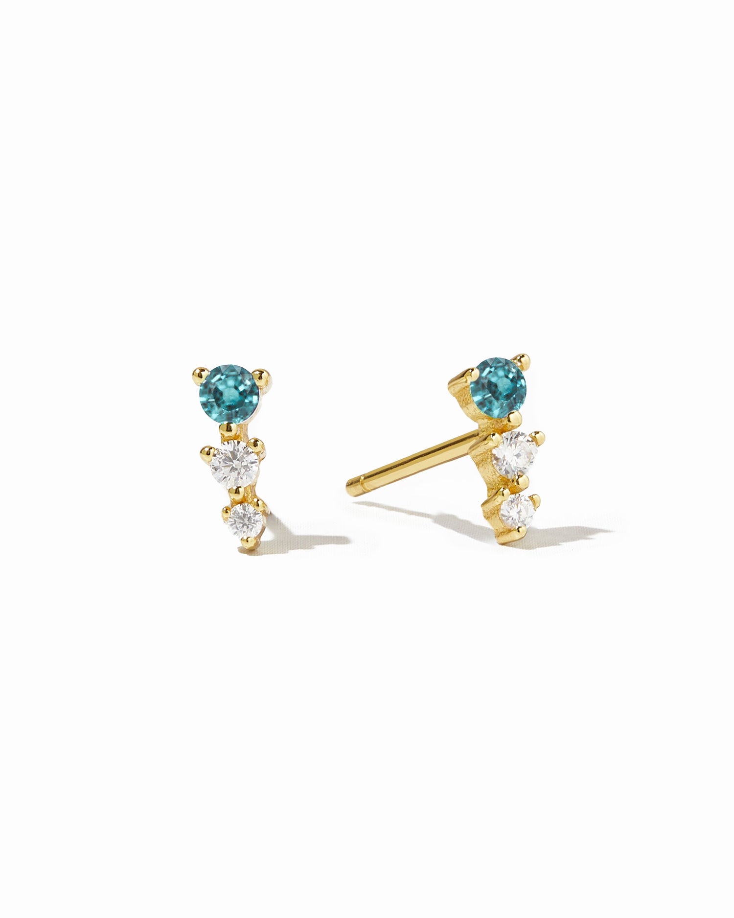 Gold Aqua & Diamond Ear Climber earrings featuring aqua stones and diamond accents on a white background.
