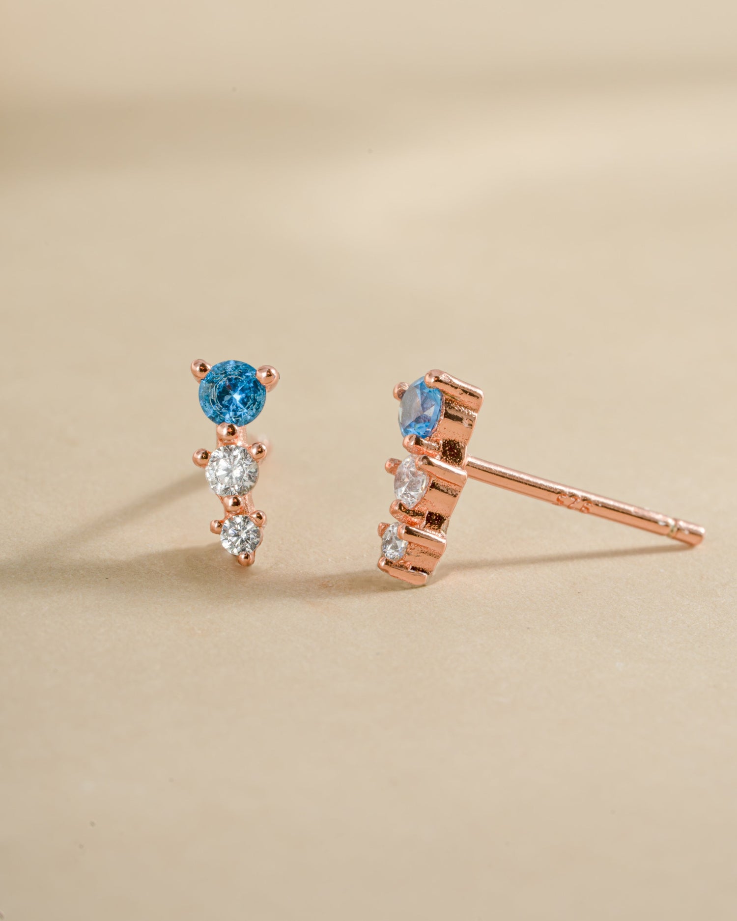 Aqua and diamond ear climber earrings in rose gold with sparkling gemstones, designed by Samijewels-527.