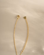 Gold Aqua Flower Necklace by Sami Jewels featuring a delicate aqua flower pendant with lobster clasp closure.