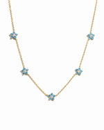 Gold Aqua Flower Necklace by Sami Jewels featuring a delicate aqua-colored flower pendant on a fine chain.