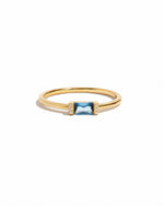 Gold aquamarine baguette ring featuring a simple design, showcased against a white background by Samijewels-527.