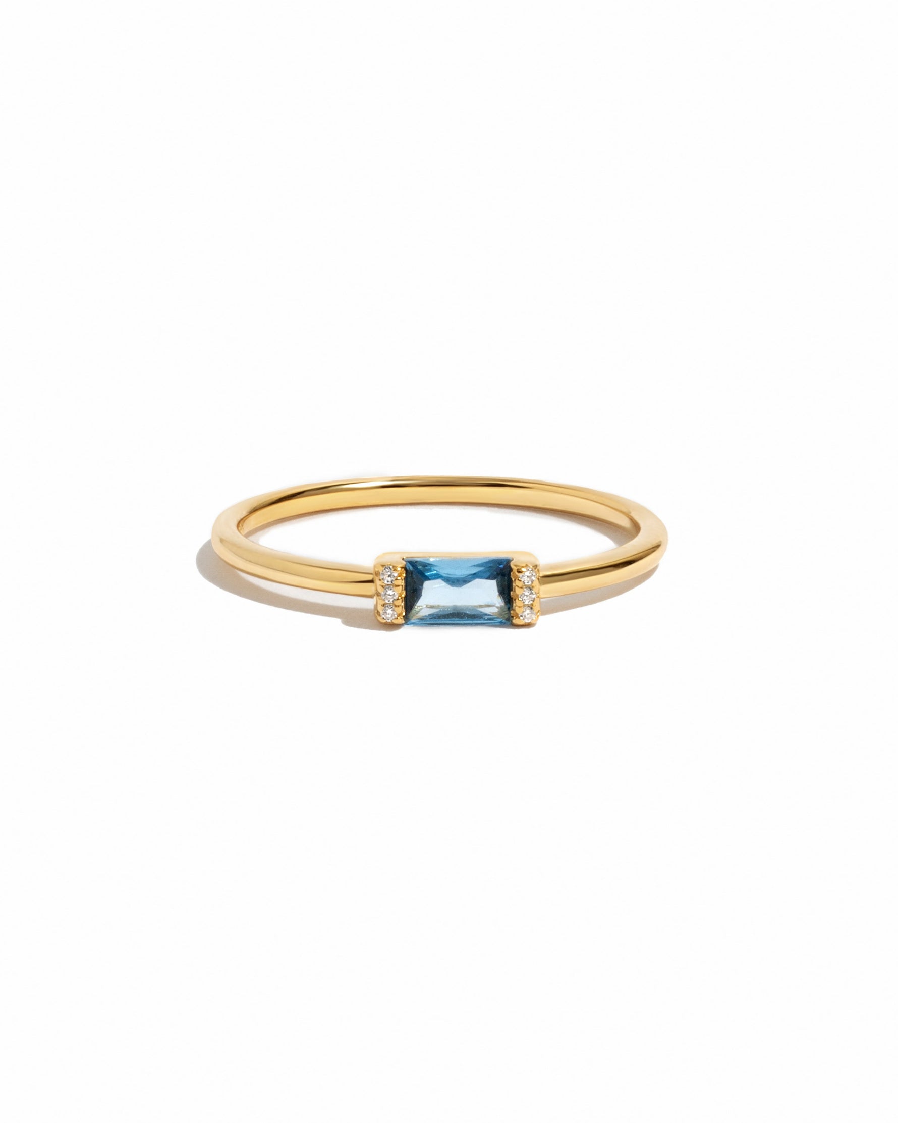 Gold aquamarine baguette ring featuring a simple design, showcased against a white background by Samijewels-527.