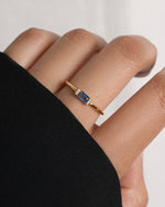 Gold aquamarine baguette ring by Samijewels-527 featuring a sleek, rectangular aquamarine gemstone set in a simple band.