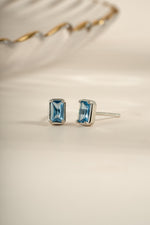 Sami Jewels aquamarine baguette stud earrings in sterling silver, angled view showing elegant rectangular gemstone design.