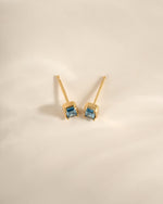 Gold aquamarine baguette stud earrings by Sami Jewels, top view showcasing elegant gemstone cuts and sleek design