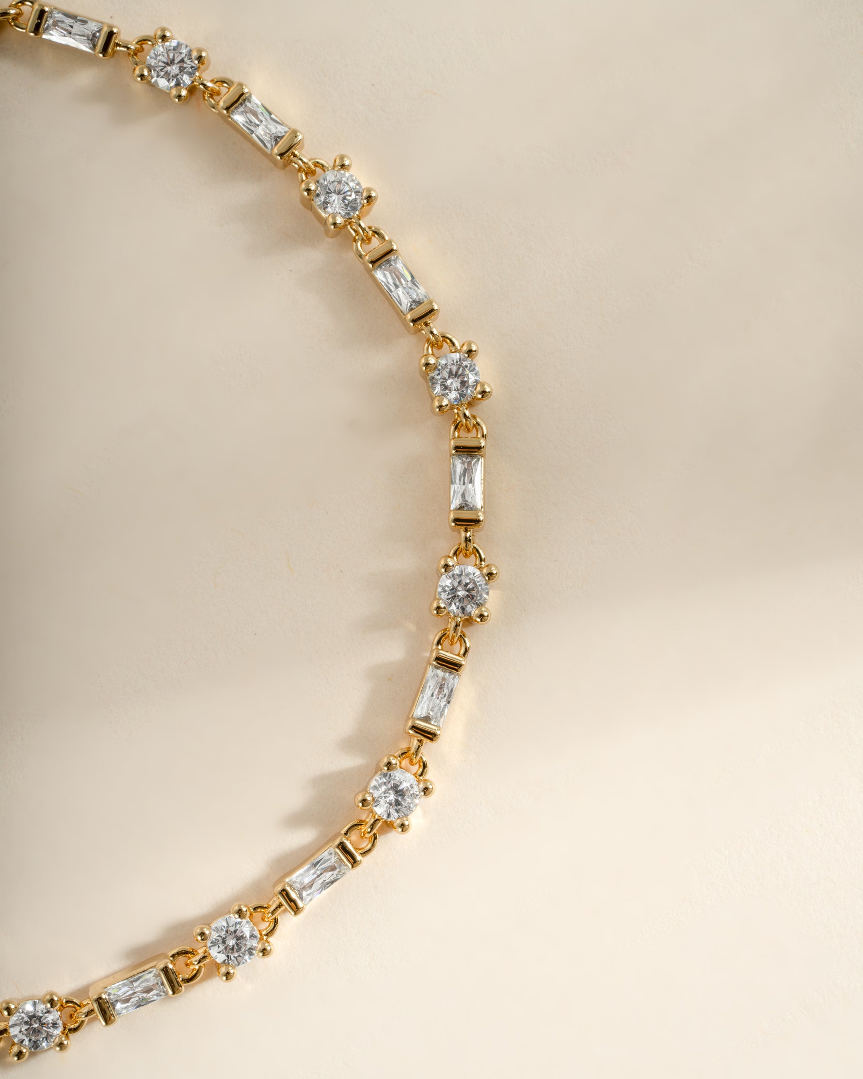 Close-up of Sami Jewels Baguette and Solitaire Diamond Bracelet in gold, showcasing the elegant design and sparkling diamonds.