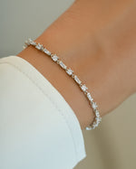 Silver Baguette and Solitaire Diamond Bracelet by Sami Jewels, featuring sparkling baguette-cut and solitaire diamonds on a sleek bracelet.