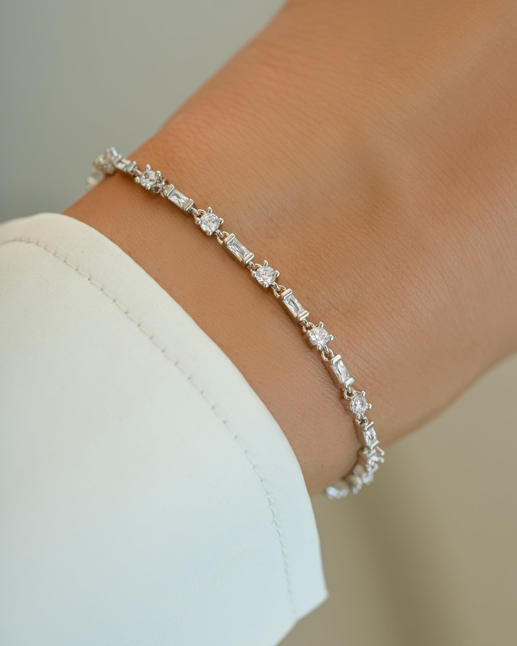 Silver Baguette and Solitaire Diamond Bracelet by Sami Jewels, featuring sparkling baguette-cut and solitaire diamonds on a sleek bracelet.
