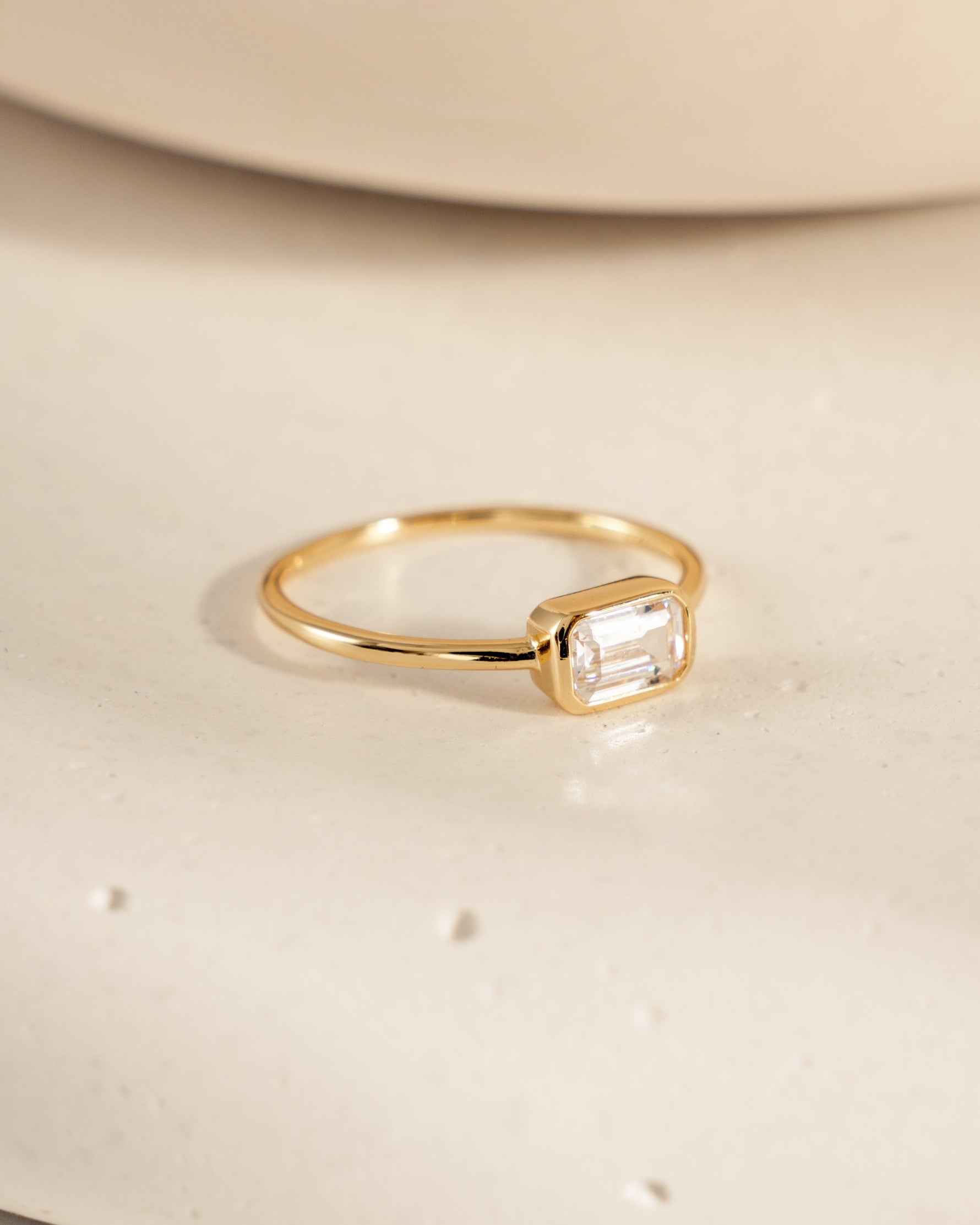 Gold Baguette Bezel Ring from Sami Jewels, side view showcasing the elegant baguette-cut gemstone setting.